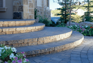 Rounded paver steps leading to home entrance