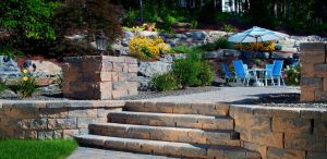Paver stone steps leading to outdoor patio dining area